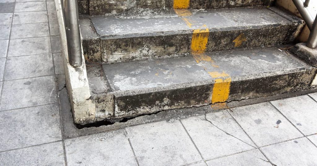 broken, damaged steps on a dangerous property