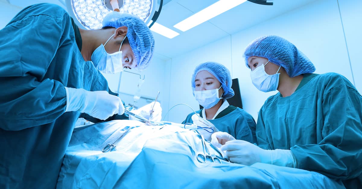 medical team performing surgery in an operating theatre