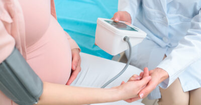 Doctor takes pregnant woman's blood pressure | Klein Lawyers