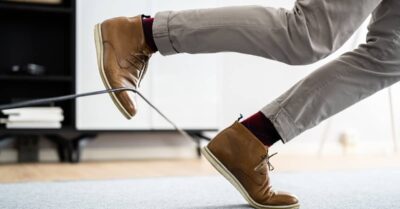 Man's foot catches on cord in a trip and fall accident. | Klein Lawyers